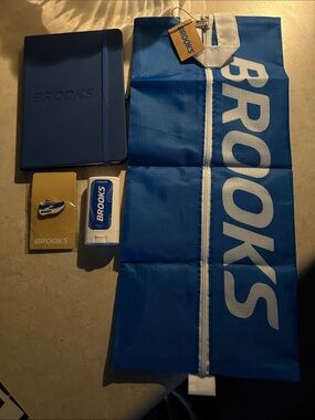 Brooks New Blue Accessories Bundle with Shoe Bag, Notebook, Pin, & Cooling Stick